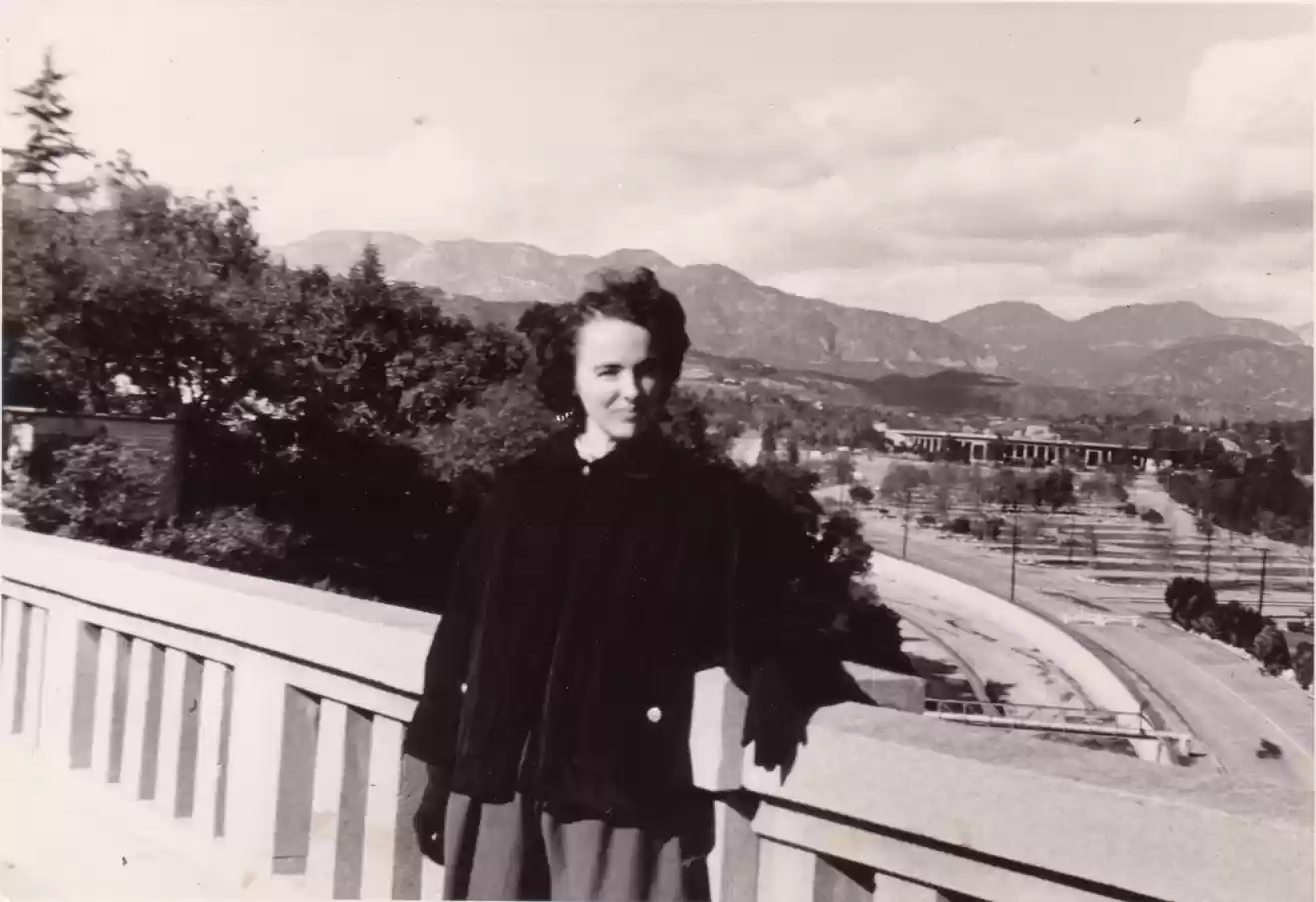 Mrs Herrmann on bridge. Rosebowl in background c1952